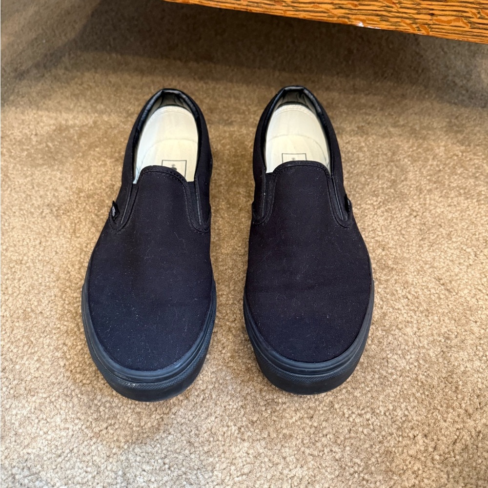 All black slip on Vans